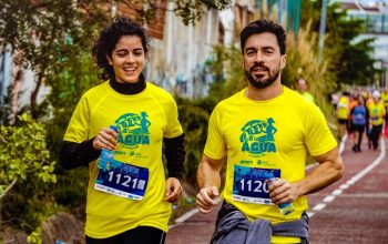 Two athletes participating in a marathon, showing determination and joy.
